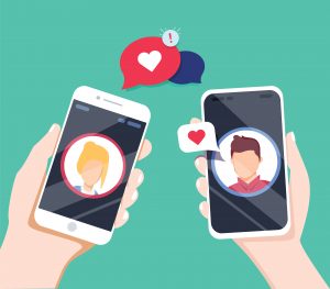 Graphic of a couple texting loving messages, focused on two phones held in separate hands. Image licensed through Adobe Stock.